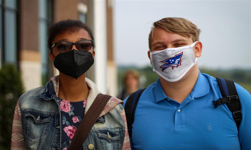 Two students wearing masks